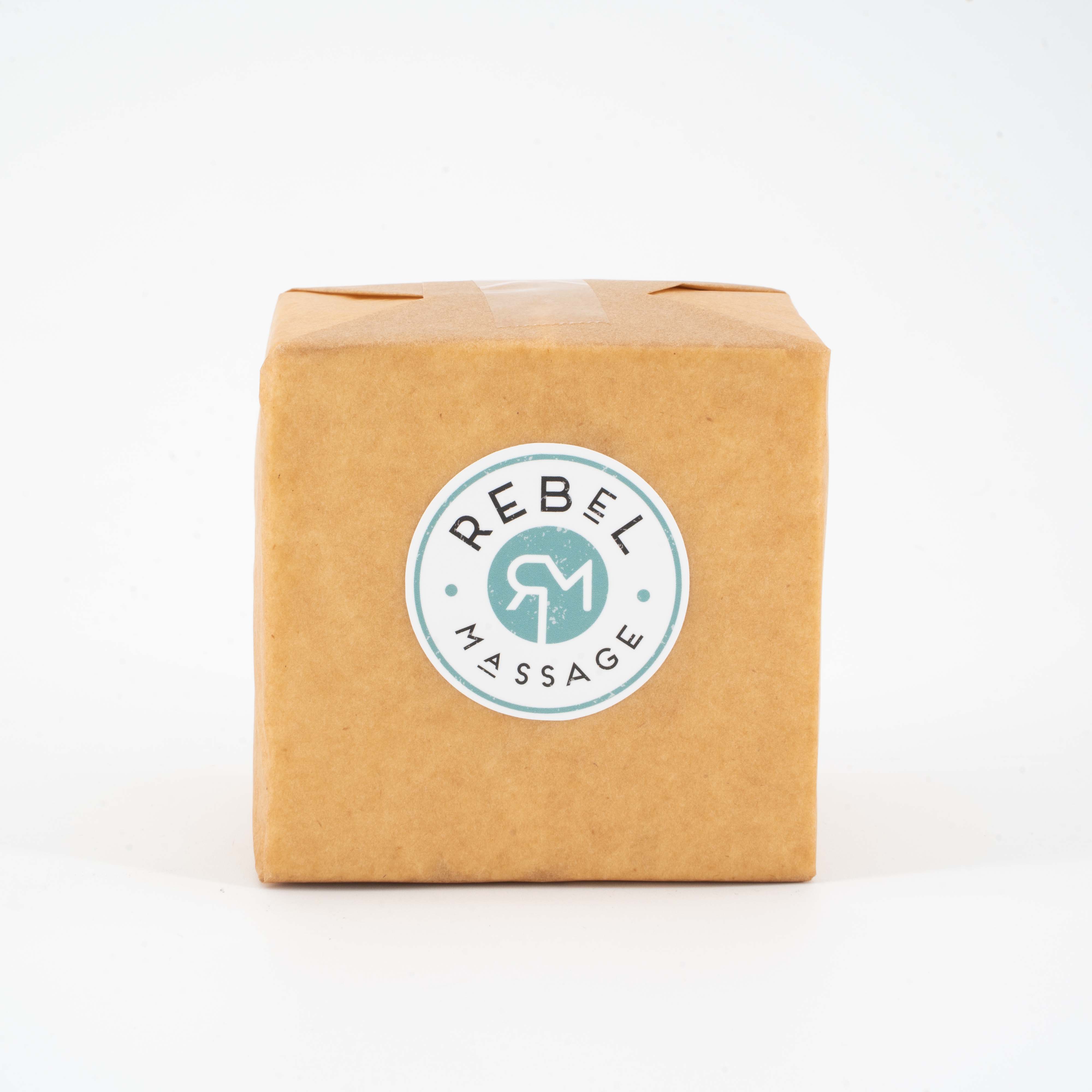 Kraft paper 1lb box with a 'Rebel Massage' label on a white background