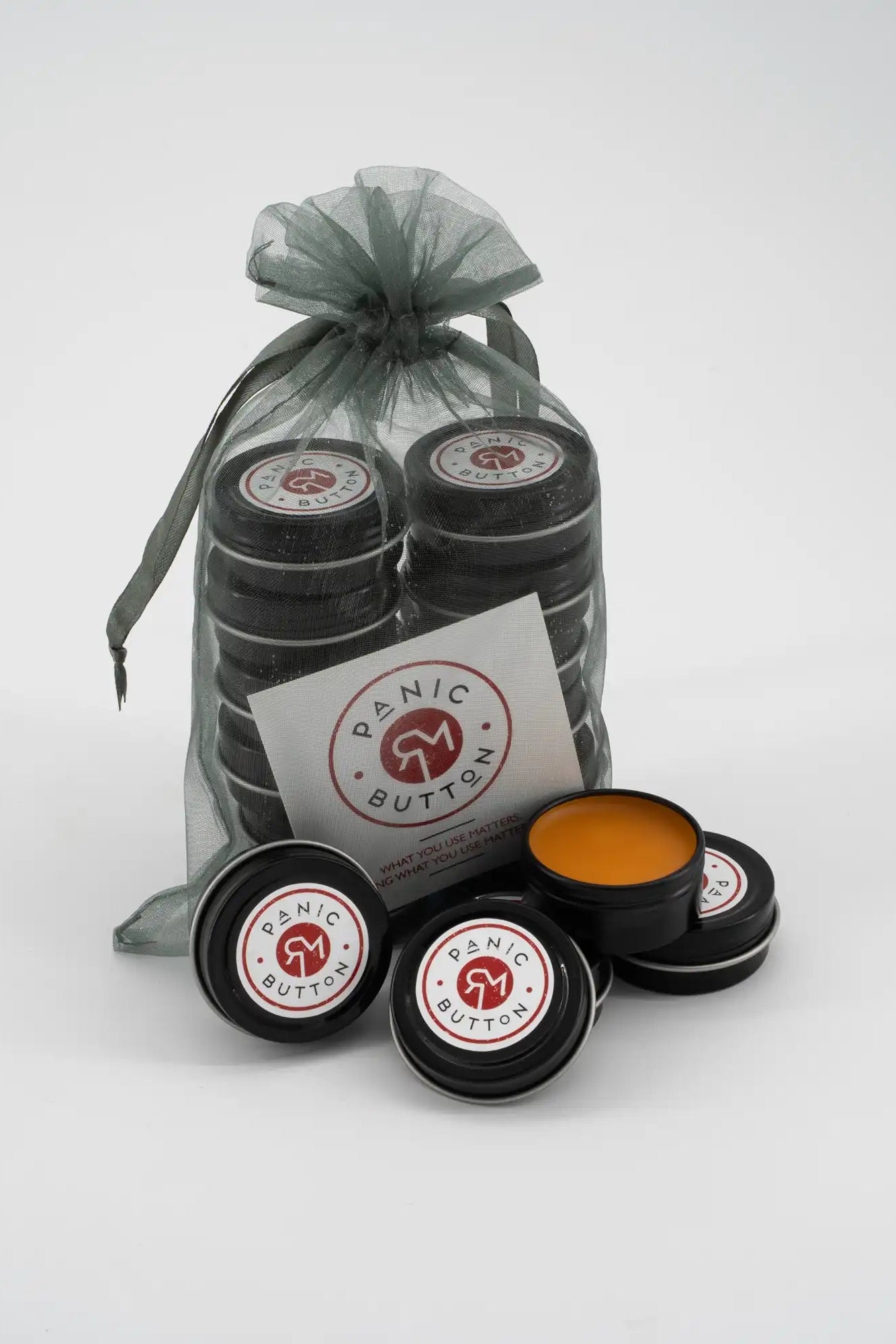 Panic Butter products with a drawstring bag on a white background