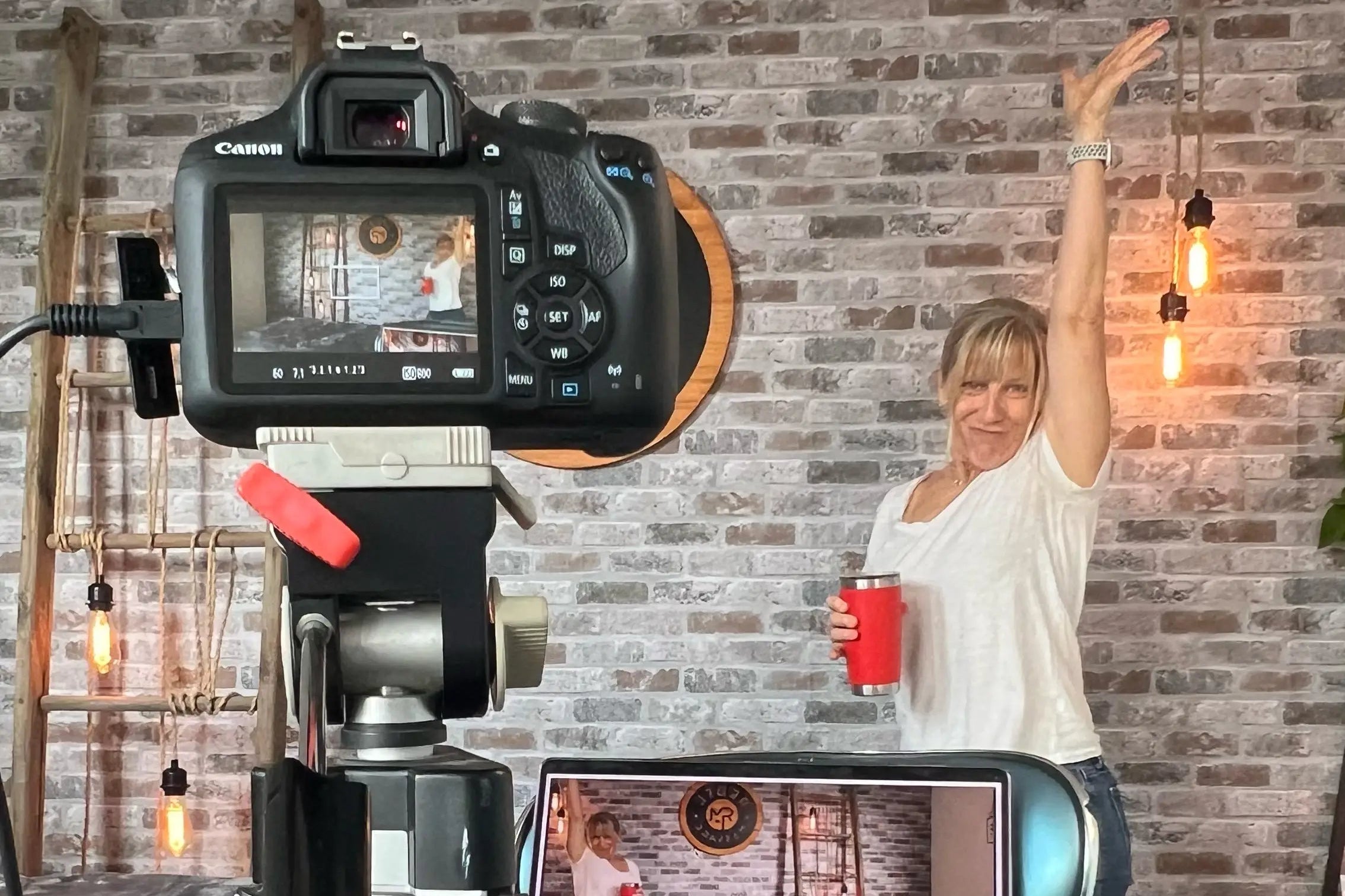 Camera on a tripod recording massage tutorial by Allison Denney at Rebel Massage HQ